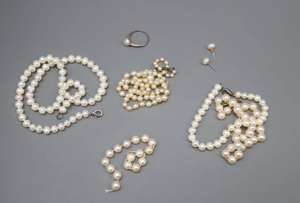 A graduated cultured pearl necklace, 47cm, a single strand pearl necklace, 39cm, a bracelet, another necklace and a dress ring